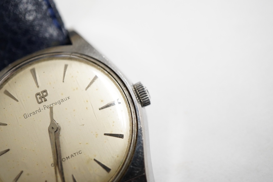 A gentleman's stainless steel Girard Perregaux Gyromatic wrist watch, with baton numerals, case diameter 33mm, on a later associated leather strap, no box or papers.